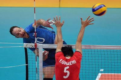 Farhad Ghaemi of Iran blocks against Jose Luis Gonzalez of Argentina spikes